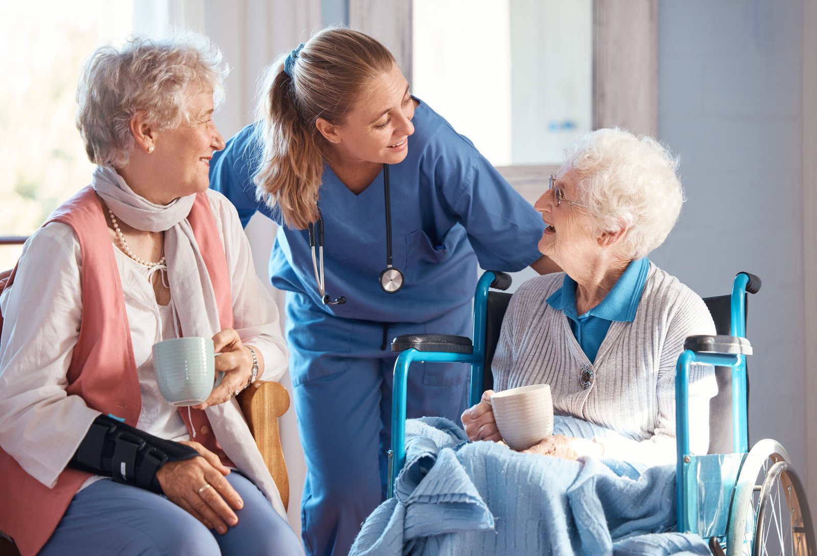 elderly woman in wheelchair consulting a doctor at retirement facility