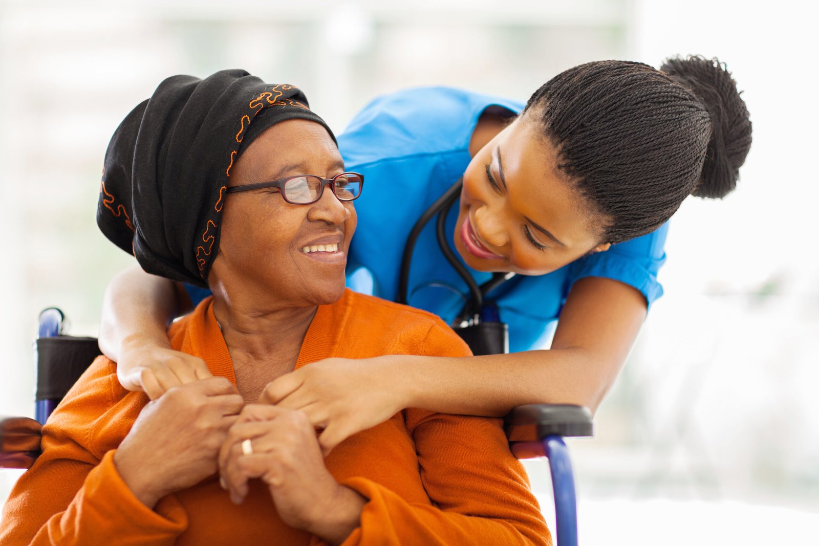 happy senior patient with friendly female nurse